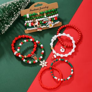 Christmas bracelet set with reindeer bells, Christmas tree beads, and woven polymer clay.