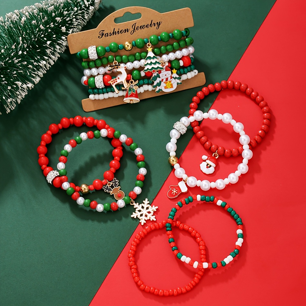 Christmas bracelet set with reindeer bells, Christmas tree beads, and woven polymer clay.